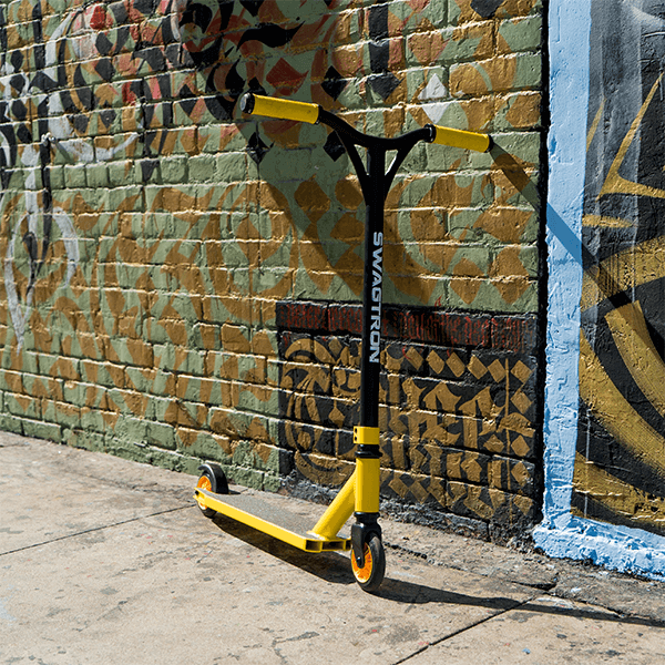 Swagtron black and yellow stunt scooter